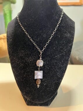 Retired Silpada necklace  sterling silver with mother of pearl and tigers eye.